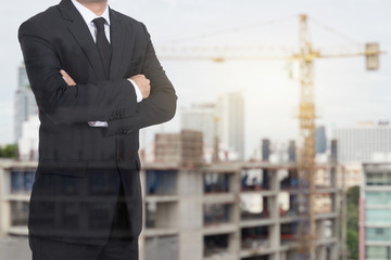 Smart  Architect , engineer boss stand on city Building construction site background