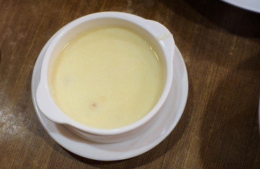 Cream mushroom and sweet corn soup .