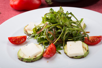 Grilled cheese salad mixed with arugula