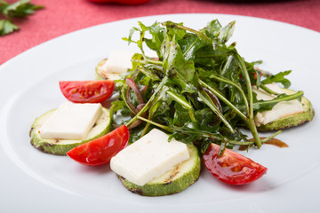 Grilled cheese salad mixed with arugula