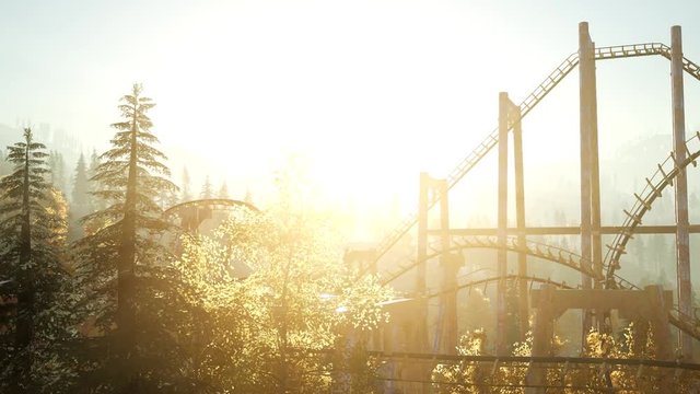 old roller coaster at sunset in forest