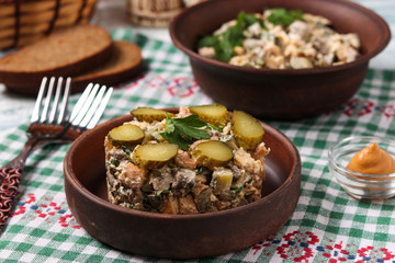 Salad with chicken liver, omelette and pickled cucumbers