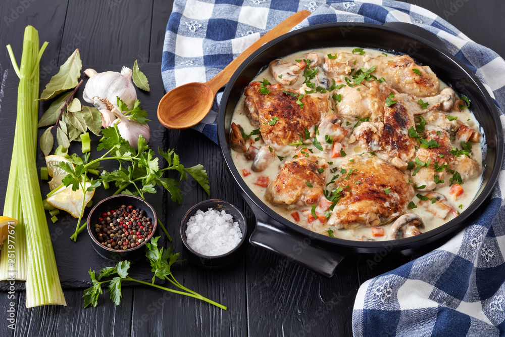 Wall mural chicken fricassee in a black dutch oven