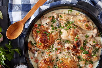 chicken fricassee in a dutch oven, flat lay