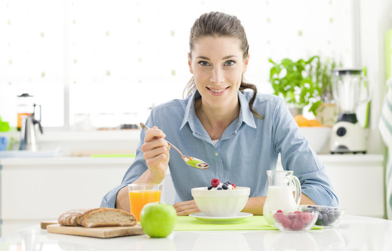 Smiling Woman Having Breakfast At Home