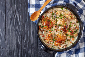 chicken fricassee in a ceramic casserole, flatlay