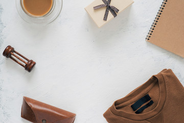 Still life, fashion, business, father's day concept. T-Shirt and frame for father day's greeting on white background. Selective focus, top view, copy space background