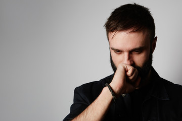 Handsome bearded man on empty background