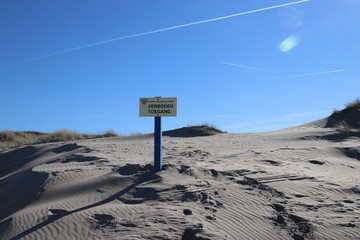 Sign with dutch text Verboden toegang which means in English no admittance of the water authority...