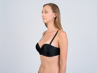 Fototapeta premium Portrait of blonde woman in bikini thinking