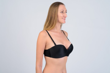 Obraz premium Portrait of happy blonde woman in bikini thinking