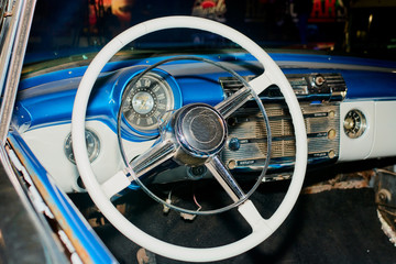 the wheel of an old vintage car