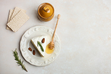 white Camembert cheese with honey and spices and crispbread