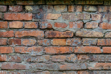 Brick stonework with plaster and cement background