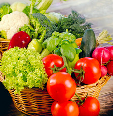 Healthy food - fresh organic vegetable in wicker basket