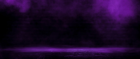 Dark empty room, old brick walls, concrete floor, smoke, pyal, smog. Violet abstract light, night view.