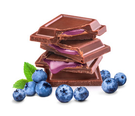 pieces of black chocolate blueberry filling on a white background