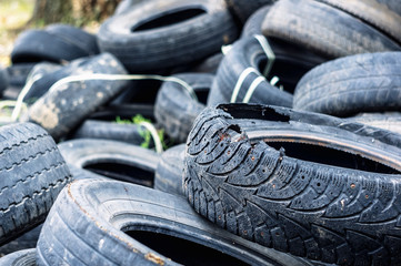 A bunch of old tires from used cars.