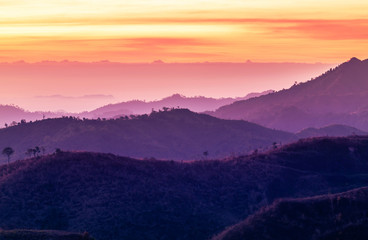 Colorful landscape view in early morning before the sunrise with misty covered mountain hills at Thong Pha Phum. Kanchanaburi, Thailand