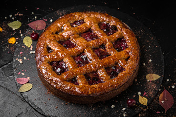 Cherry or berry pie.  Fragrant, Christmas dessert or summer on black background