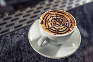 Coffee art artistic pattern on latte or cappuccino