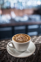 Coffee art artistic pattern on latte or cappuccino