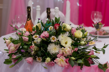 wedding table decoration with a bouquet of fresh flowers