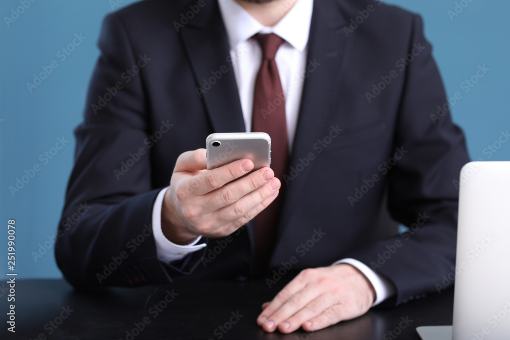 Canvas Prints Businessman using mobile phone in office, closeup