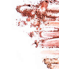 Crushed blusher dispersed on white background. Top view shot. Fashion and makeup conception.