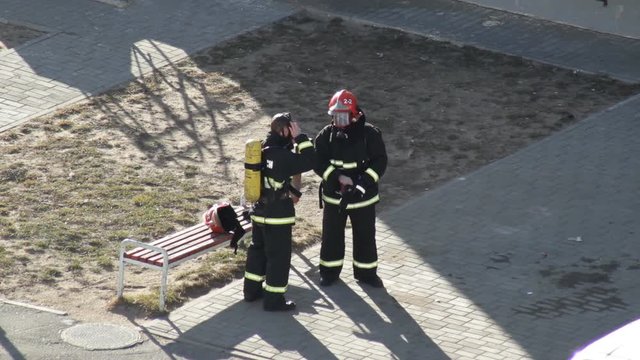 Fireman man puts on equipment and fire equipment before starting work, training, exercises, professional