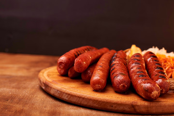 sausage on wooden cutting board