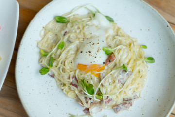 Carbonara pasta with cheese and egg onsen