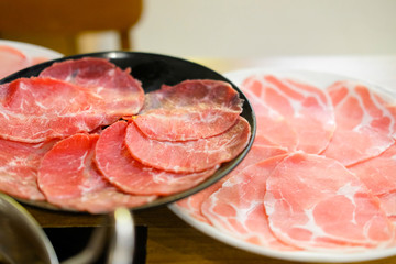 Raw red beef and raw pork slice for Shabu and Sukiyaki Japanese style.