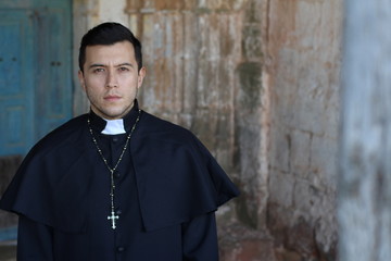 Handsome ethnic classic catholic priest