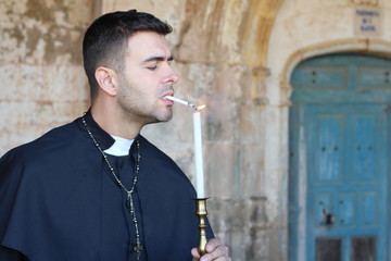 Preacher with nicotine addiction lighting a cigarette 