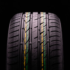 new summer rain tire on black background