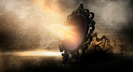Mirror magic, fortune telling and fulfillment of desires. Fantasy with a mirror, dark room, magical...