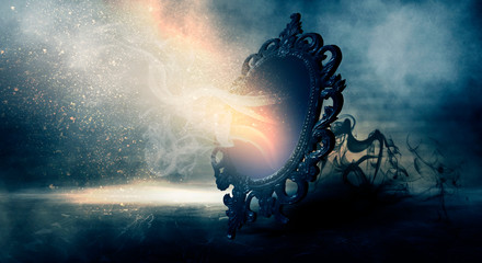 Mirror magic, fortune telling and fulfillment of desires. Fantasy with a mirror, dark room, magical...