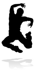 A male street dance hip hop dancer in silhouette