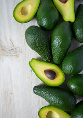 avocado on white wooden surface