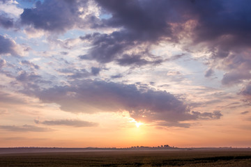 Evening scenery: dramatic sky with dark clouds during the sunset_