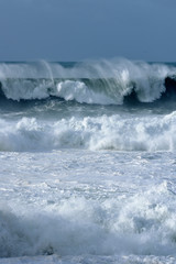 Fototapeta premium snapshot of a wave breaking in the sea