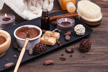 Chocolate spa set on the wooden background, close-up.