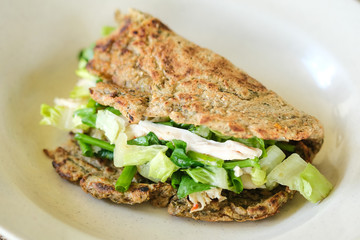 Chicken salad with oatmeal wrap shot on Isolated background.