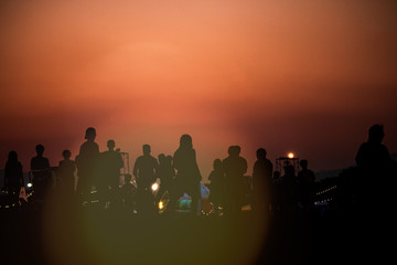 silhouettes of people taking pictures with smartphone