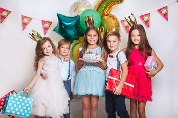 Group of funny kids celebrate birthday party together
