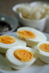 Hard boiled eggs in white dish served in restaurant with space for write wording, delicious high nutrition food that good for muscle, eye, bone and healthy growth for kids, patients and everyone