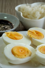 Hard boiled eggs in white dish served in restaurant with space for write wording, delicious high nutrition food that good for muscle, eye, bone and healthy growth for kids, patients and everyone