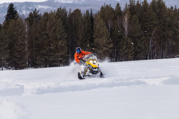 Athlete on a snowmobile.
