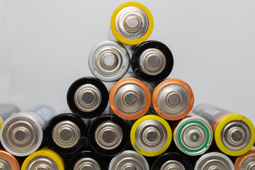 Pile of alkaline batteries.  Closeup of used AA batteries ready for recycling, colorful batteries...